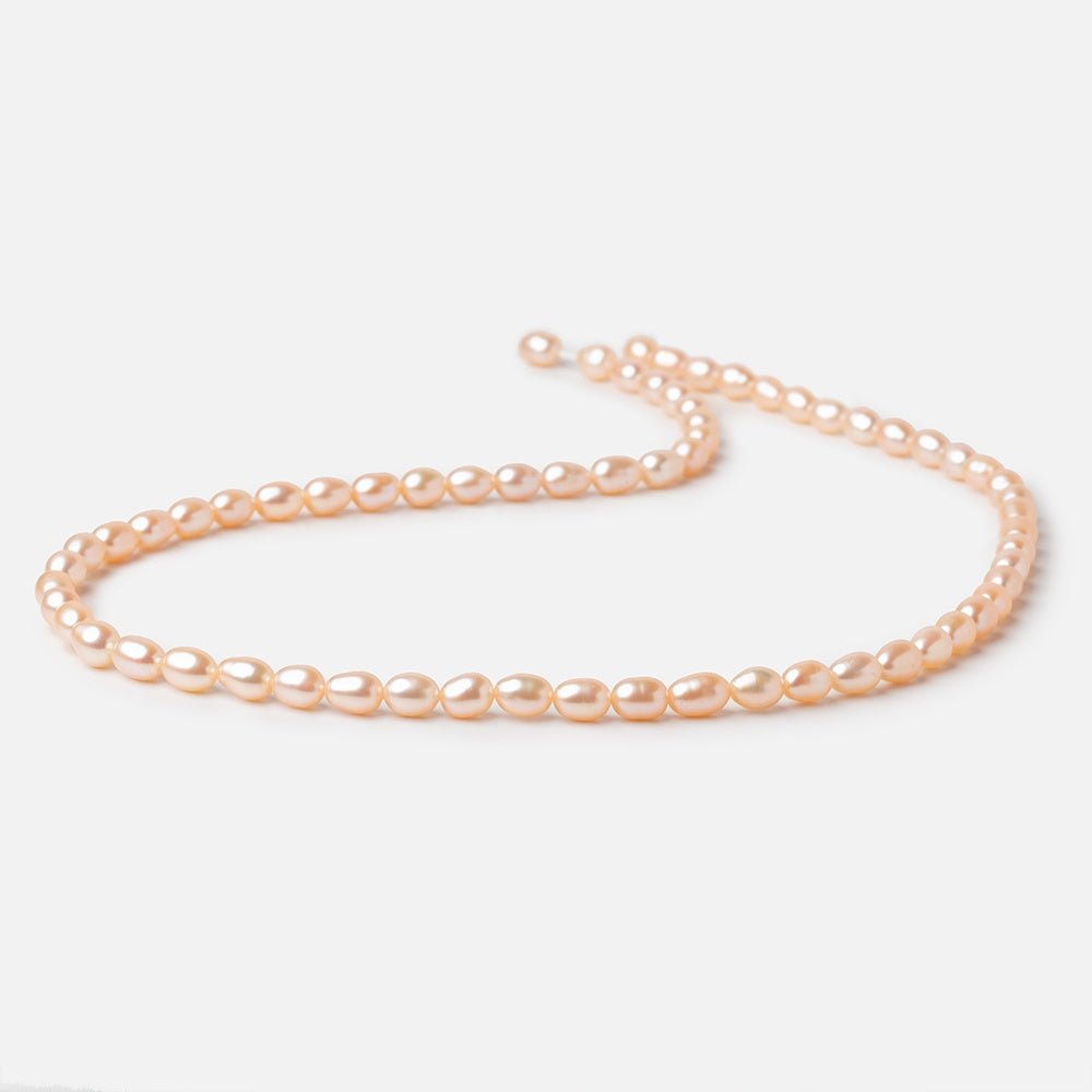 5 - 5.5mm Peach Petite Oval Freshwater Pearls 15.75 inch 75 Beads - Beadsofcambay.com