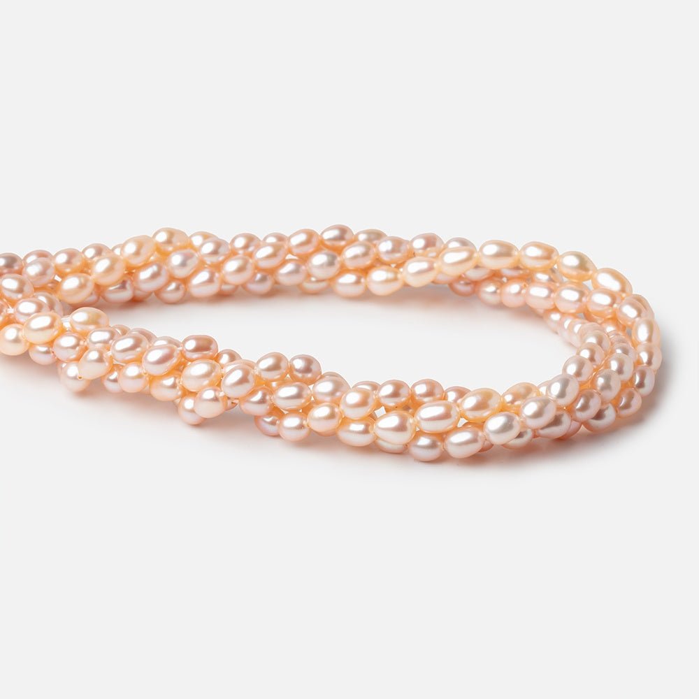 5 - 5.5mm Peach Petite Oval Freshwater Pearls 15.75 inch 75 Beads - Beadsofcambay.com