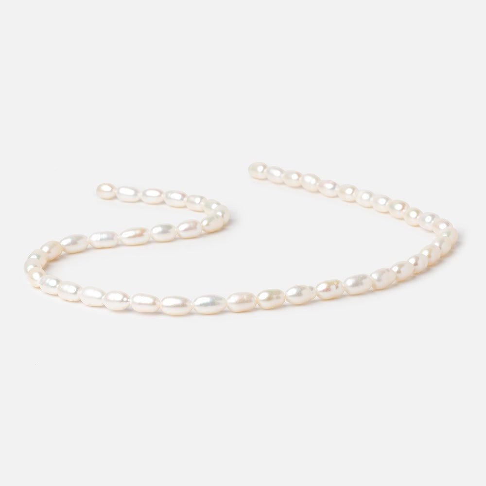 6.5 - 9mm Creamy White Oval Freshwater Pearls 15 inch 40 Beads - Beadsofcambay.com